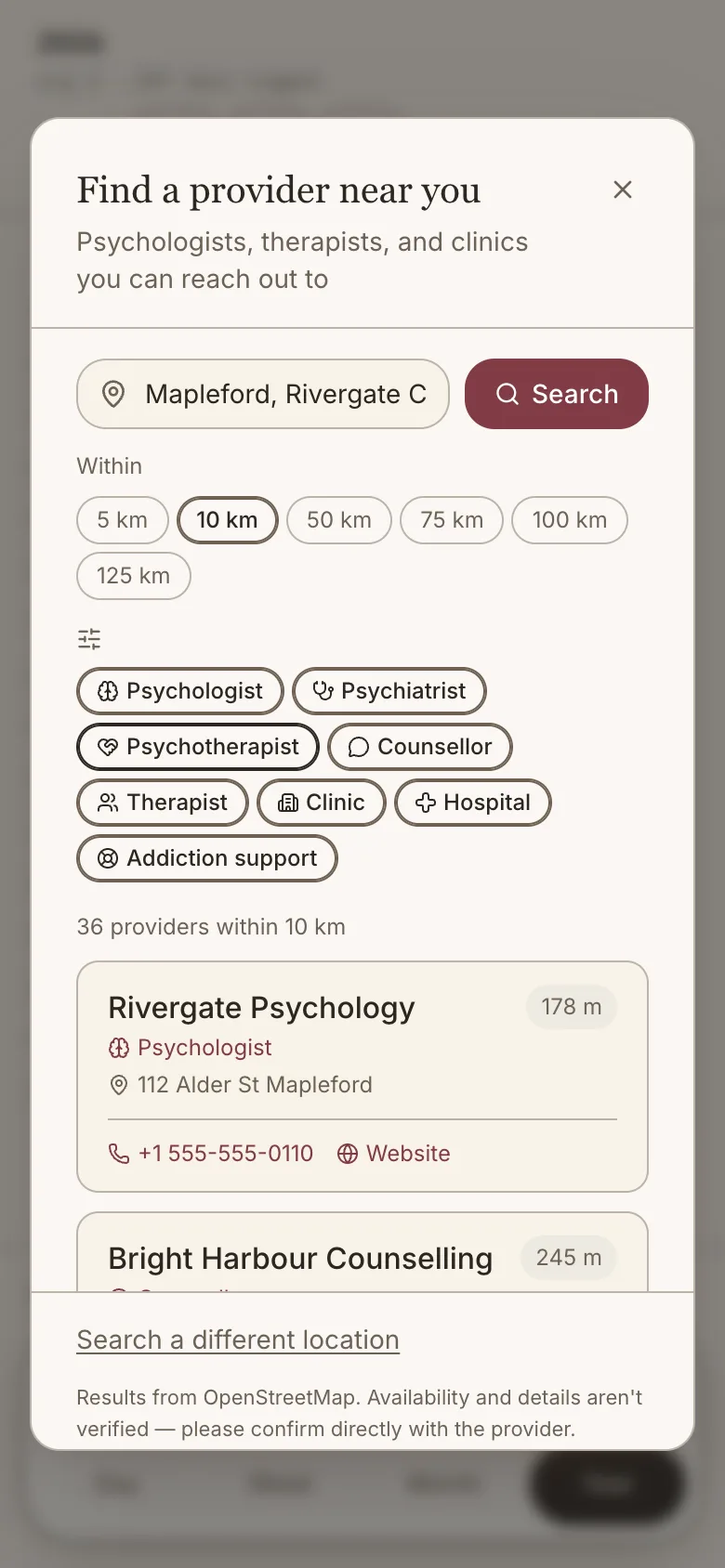 The provider search dialog: a location field reading Mapleford, Rivergate County, distance options from 5 to 125 km with 10 km selected, and filters for psychologist, psychiatrist, psychotherapist, counsellor, therapist, clinic, hospital and addiction support. Below them, 36 providers within 10 km — the first two listed with their type, street address, distance, phone number and a link to their website.